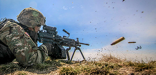A New Jersey Army National Guard soldier fires a M249 SAW during live-fire battle drills at Joint Base McGuire-Dix-Lakehurst, N.J., April 9, 2018. The soldier is assigned to Charlie Company, 1st Battalion, 114th Infantry (Air Assault). Air National Guard photo by Master Sgt. Matt Hecht. - ALLOW IMAGES