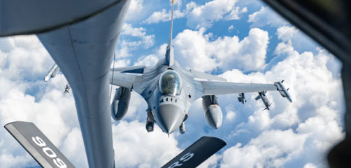 An Air Force F-16 Fighting Falcon approaches a KC-135 Stratotanker to receive fuel during Exercise Pacific Weasel over the Pacific Ocean, Jan. 21, 2022 - ALLOW IMAGES