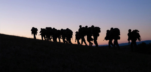 Marines hike to the next training location during Exercise Baccarat in Aveyron, Occitanie, France, Oct.16, 2021. Exercise Baccarat is a three-week joint exercise with Marines and the French Foreign Legion that challenges forces with physical and tactical training. DoD Image - ALLOW IMAGES