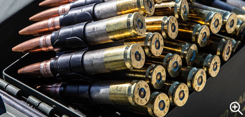 Click to Enlarge - Polymer-cased .50-caliber ammunition is seen at Marine Corps Base Camp Pendleton, California, Nov. 3, 2021. The polymer-cased ammunition is a new technology that reduces the weight of a 100-round linked belt of .50-caliber ammunition by seven pounds, reducing the weight Marines have to transport. (U.S. Marine Corps photo by Cpl. Cameron Hermanet) - ALLOW IMAGES