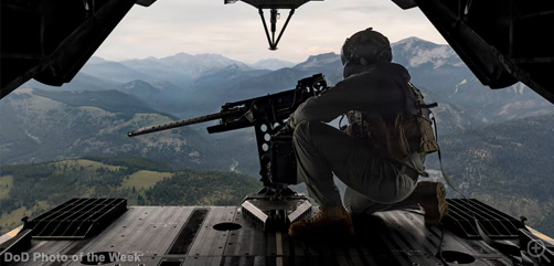 Marine Corps Staff Sgt. Kevin Baker looks out the back of a CH-53K King Stallion helicopter during a combat readiness evaluation near Helena, Mont., July 20, 2026. The evaluation was designed to ensure readiness for future deployments and operations.  - ALLOW IMAGES.